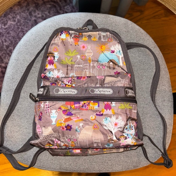 Lesportsac Handbags - Lesportsac it's a small world Disney Moroccan sun mini backpack